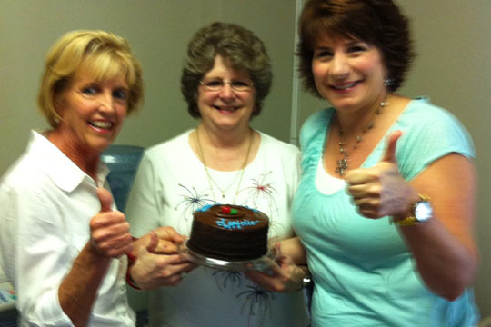 Group Photo with Cake - Thumbs Up